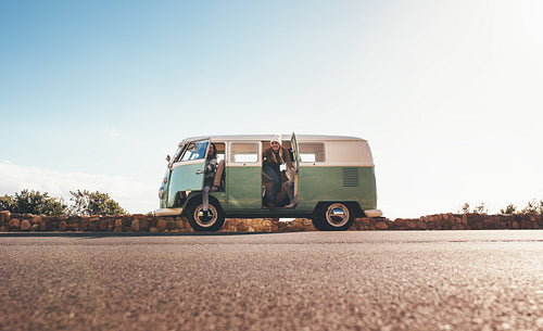 Women on roadtrip travelling together in a van