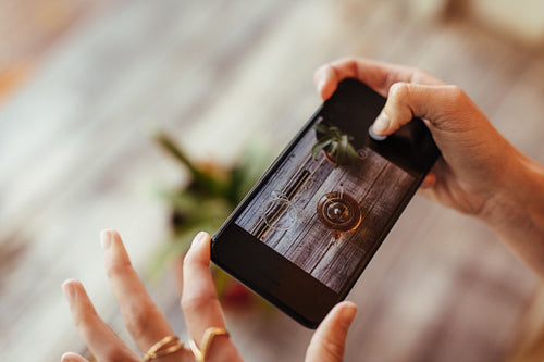 Woman taking photos for her blog