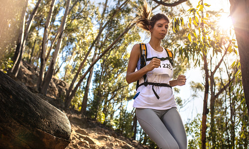 Young woman running in a mountain race