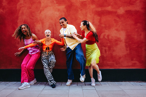 Laughing with friends together in a studio portrait for youth culture