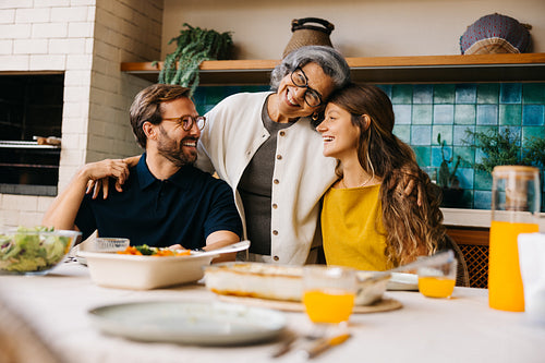 Family lunch with smiling grandmother