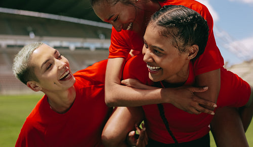 Woman soccer players celebrating a win