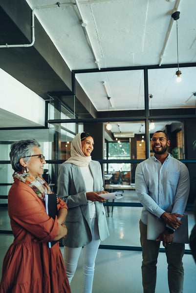 Cheerful business professionals holding a staff meeting