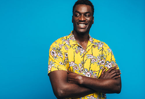 Cheerful african man looking at copy space