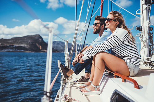 Attractive young couple enjoying a boat ride
