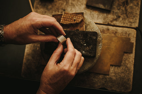 Goldsmith working on a ring