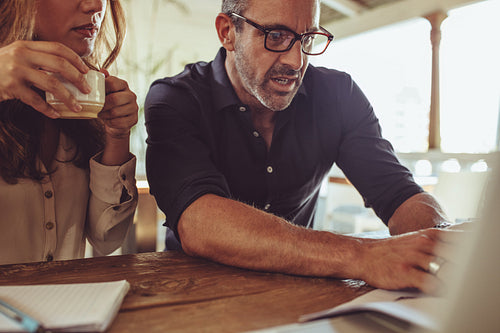 Business people discussing a project at cafe