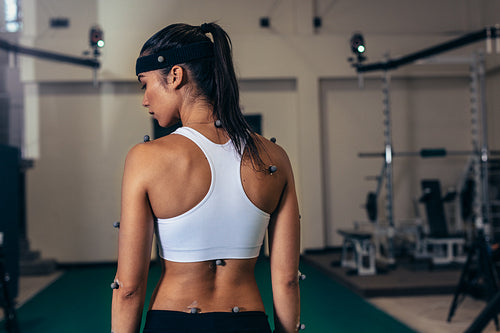 Woman with motion capture sensors at sports science lab
