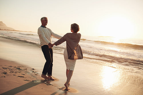 Romantic mature couple enjoying a day at the beach