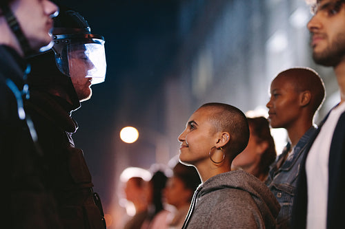 Woman smiling at the policeman during a rally