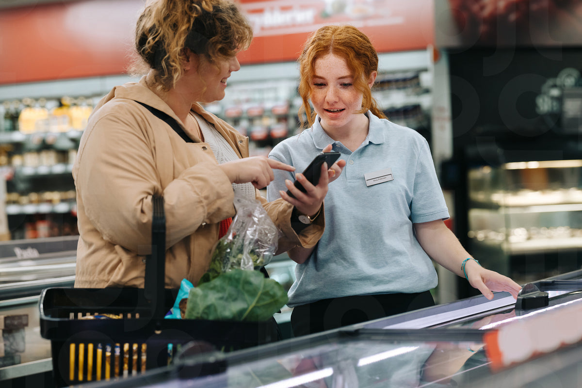 Required Store Helper Shopper taking help of a store assistant at supermarket – Jacob Lund ...