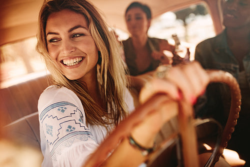 Female friends enjoying on a road trip
