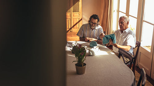 Senior men learning art of knitting after retirement