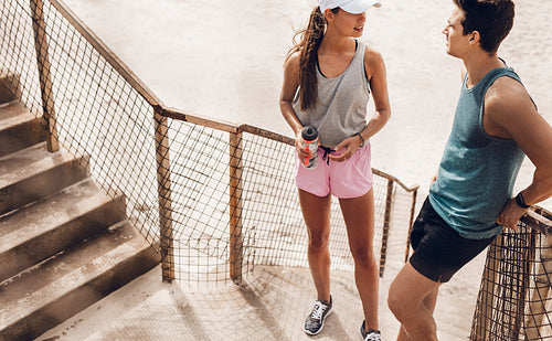Couple relaxing after running exercising session outdoors