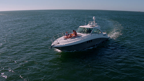 Friends relaxing on private yacht deck