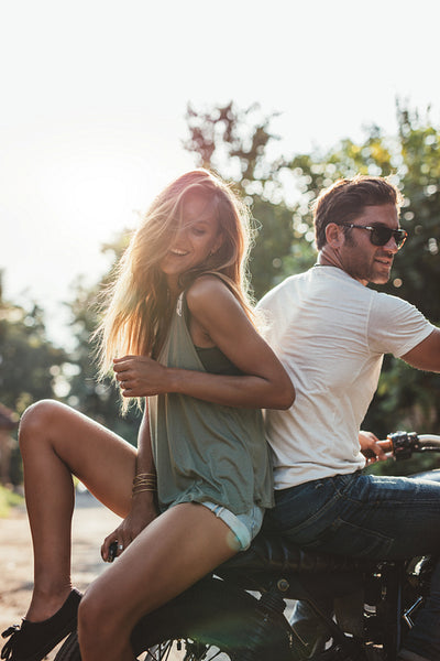 Young couple having fun on a motorcycle
