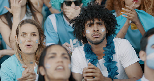 Anxious Argentinian fans watching the game at stadium