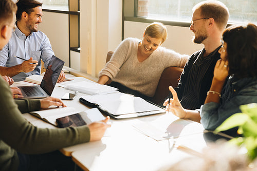 Creative team sharing a funny moment in meeting