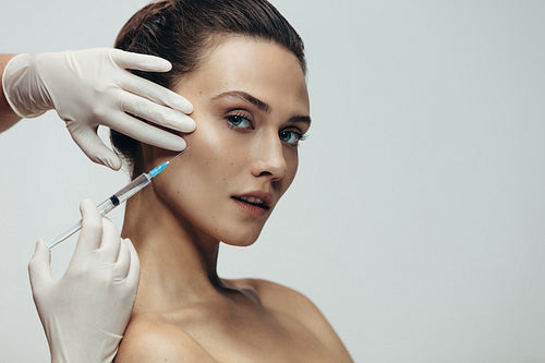 Beautiful woman having skin injections