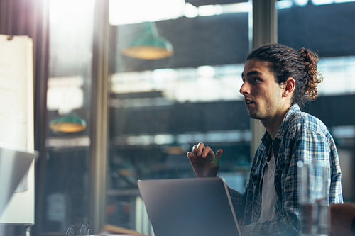 Man sharing his views in meeting