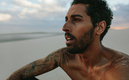 Man taking rest after exercising in desert