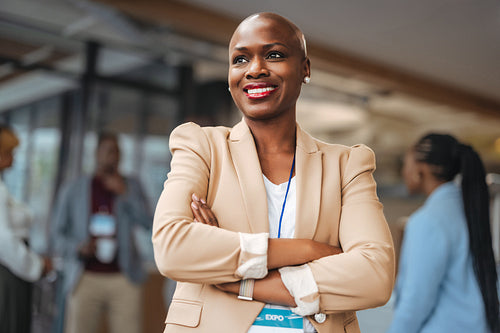 Empowered businesswoman attending a corporate event with other professionals