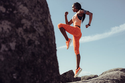 Woman doing warm up exercises outdoors