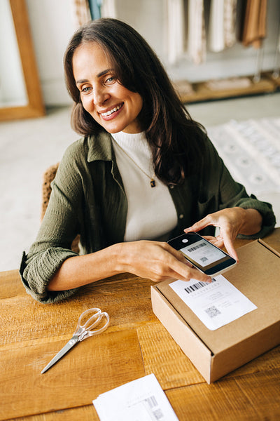 Efficiently fulfilling orders with a smile: Online store owner scans barcodes on mobile app