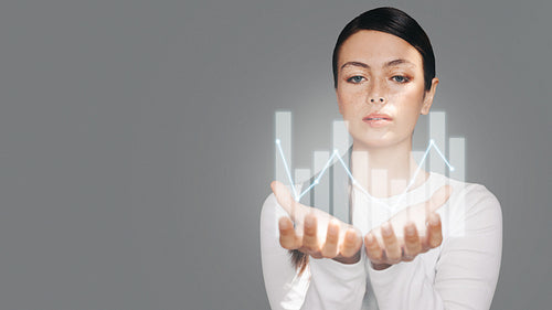 Woman holding a digital graph icon in her hands