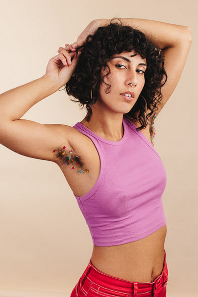 Unapologetic young woman showing her unshaven underarms