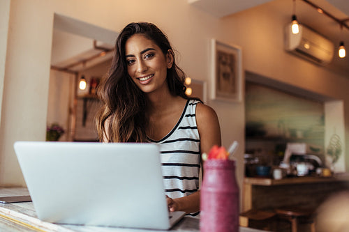 Woman working on laptop computer