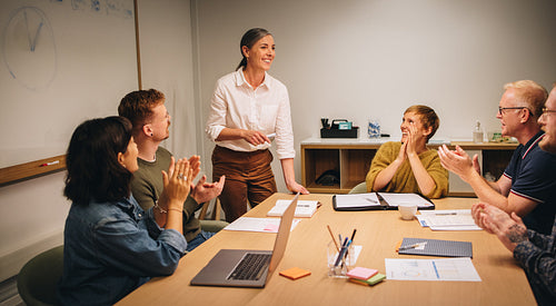 Executive appreciated by clapping for successful strategy planni