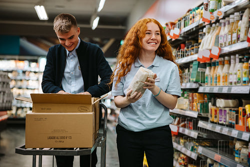 Supermarket employees at work