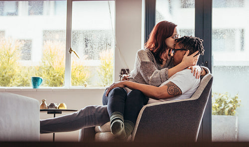 Romantic interracial couple at home