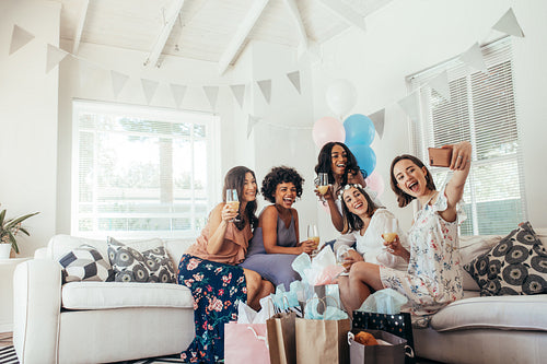 Group of friends making selfie in baby shower party