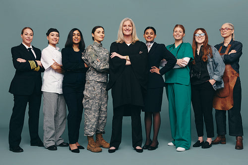 Multiethnic female professionals smiling happily in a studio