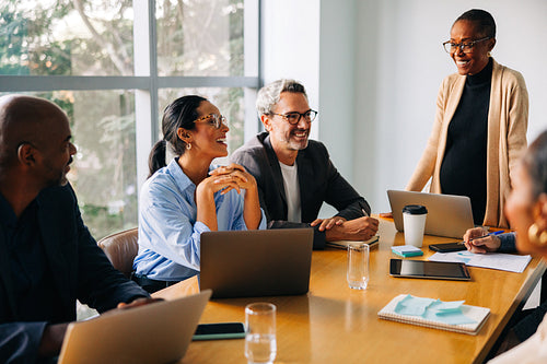 Diverse colleagues gathered around a table during a professional meeting