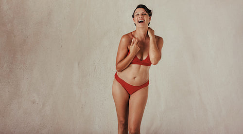 Middle aged woman celebrating her natural body