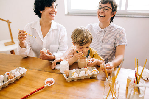 Family preparing Easter eggs