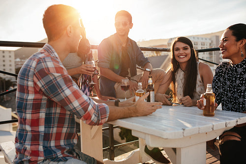 Group of friends having a rooftop party
