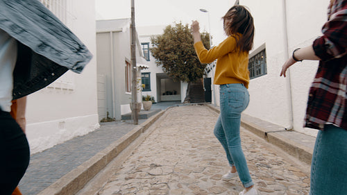 Friends having fun and dancing outdoors