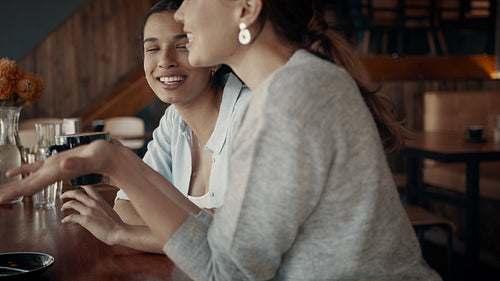 Best friends hanging out at a cafe