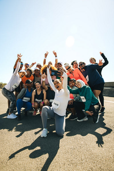 Joyful running club takes a selfie at marathon event