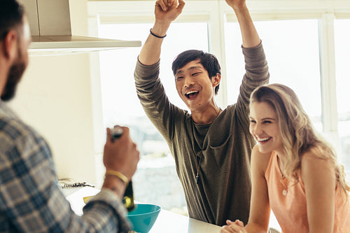 Happy friends having fun at a beach house
