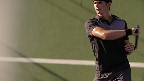 Professional tennis player practicing forehands shots