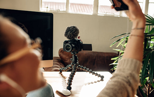 Female blogger recording content on a camera