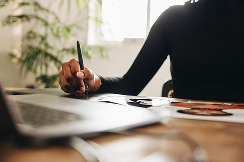 Anonymous designer drawing on a graphics tablet