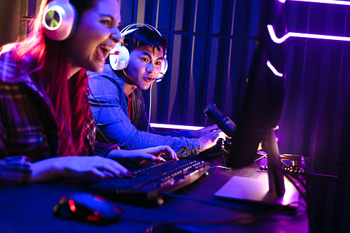 Woman taking the lead in a gaming contest with her male competitor