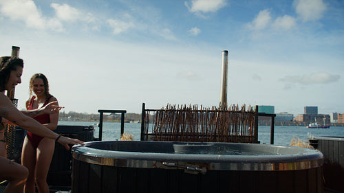 Wellness brings women and friends together for a cold plunge by the harbor