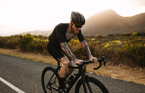 Active sportsman cycling road bike